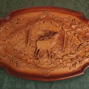Natural wood carved panel depicting a hunting